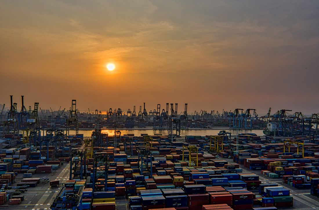Container terminal at a major port at sunset