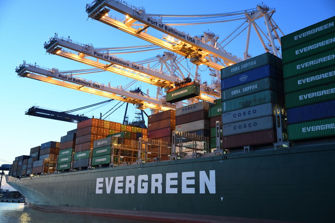 Container terminal cranes loading freight at a Dubai port